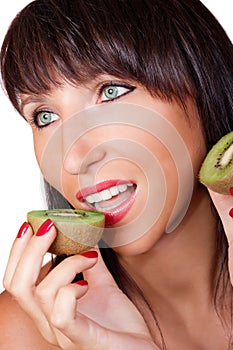 Woman eating kiwi