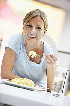 Woman Eating Lunch At A Cafe