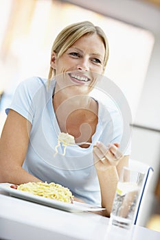 Woman Eating Lunch At A Cafe