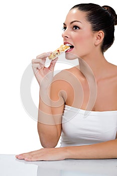 Woman eating macrobiotic candy bar