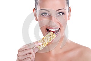 Woman eating muesli bar snack