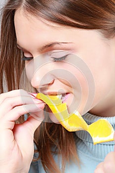 Woman eating orange
