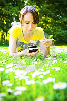 Woman eating in park