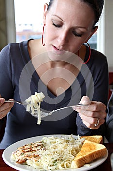 Woman Eating Pasta