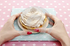 Woman eating pavlova cake (meringue)