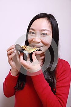 Woman eating pizza