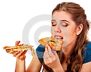 Woman eating pizza. Student consume fast food on table.