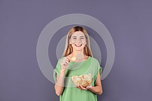 Woman eating potato chips