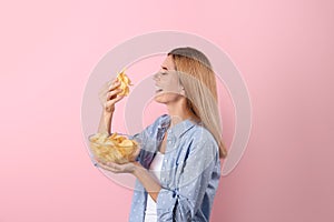 Woman eating potato chips