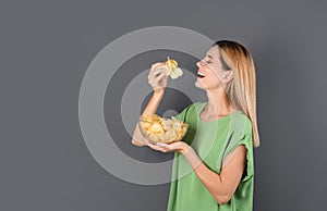 Woman eating potato chips