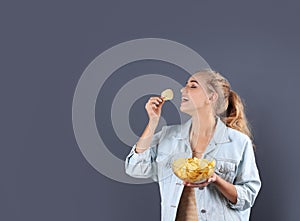 Woman eating potato chips