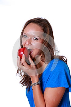 Woman eating a red apple.