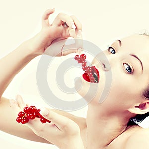 Woman eating red berries