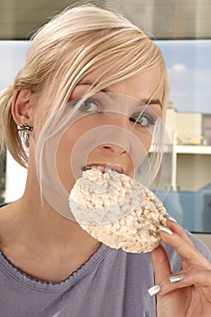 Woman eating rice cracker