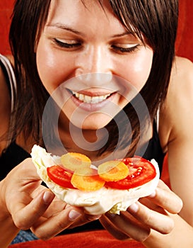 Woman eating sandwich