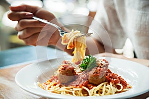 Woman eating spaghetti