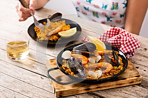 Woman eating spanish seafood paella