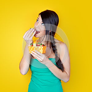 Woman eating strawberries