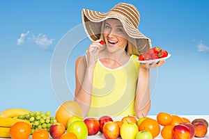 Woman eating a strawberry