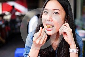 Woman eating Chinese steamed dumpling