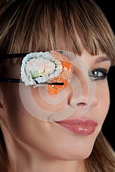 Woman eating a sushi