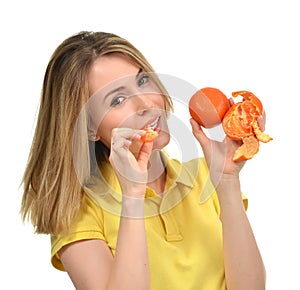 Woman eating tangerine mandarin fruit