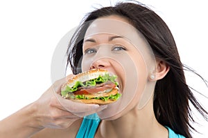 Woman eating tasty fast food unhealthy burger