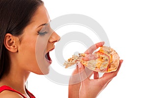 Woman eating tasty piece of pizza. Unhealthy fast food meal.