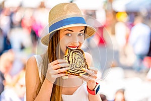 Woman eating traditional slovenian dessert