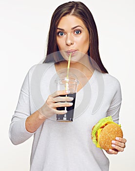 Woman eating unhealthy meal, fast food. Burger