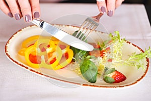 Woman eating vegetable salad