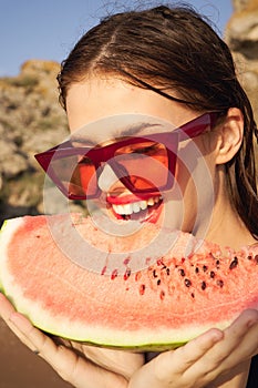woman eating watermelon outdoors Sun summer close-up