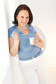 Woman eating yoghurt