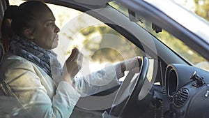 a woman eats cookies at the wheel of a car and choked heavily