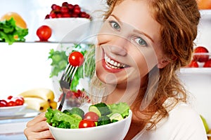 woman eats healthy food vegetable vegetarian salad about refrigerator