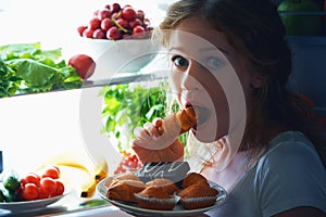 Woman eats night stole the refrigerator photo