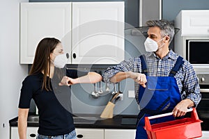 Woman Elbow Bump With Repair Man Or Handyman