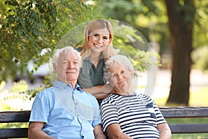 Woman with elderly parents in park