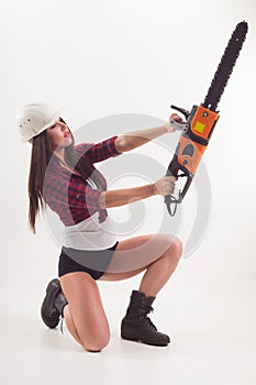 A woman with an electric saw in her hand