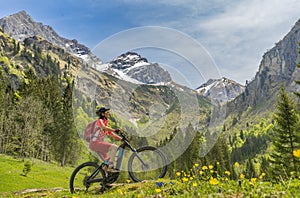 Woman on electrick Mountain bike in the Oy Tal Valley, Allgaeu Alps Below Nebelhorn
