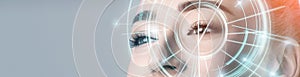 Woman with electronic information analysing inside eye