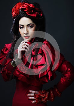 Woman in elegance red costume with red hat.