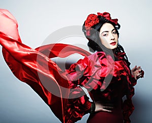 Woman in elegance red costume with red hat.