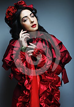 Woman in elegance red costume with red hat.