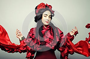 Woman in elegance red costume with red hat.