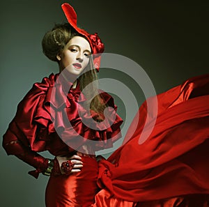 Woman in elegance red costume with red hat.