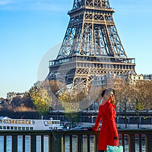 Woman on embankment in Paris, France looking into distance