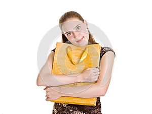 Woman embrace big yellow package with present