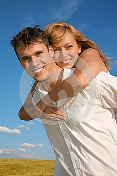 Woman embraces man