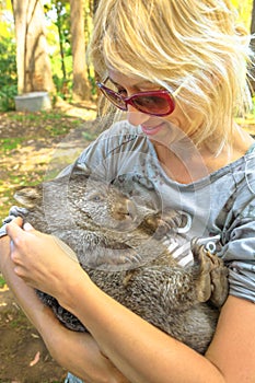 Woman embraces Wombat